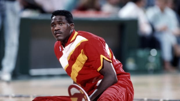 Hawks forward Dominique Wilkins stretches before a game.
